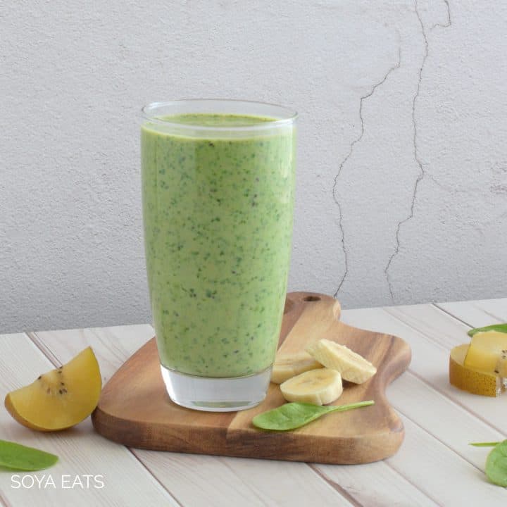 A green goddess smoothie made with spinach, kiwi fruit, and silken tofu.