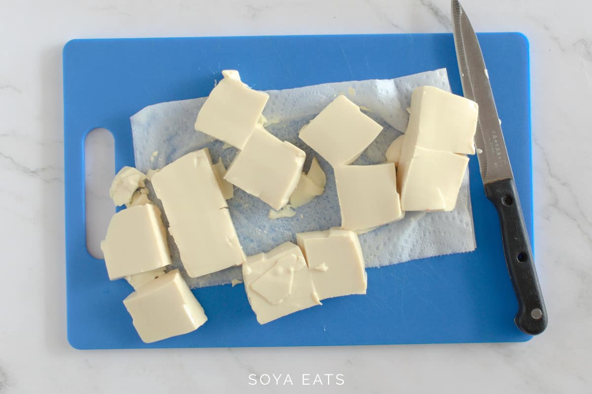 Silken tofu cut into pieces.
