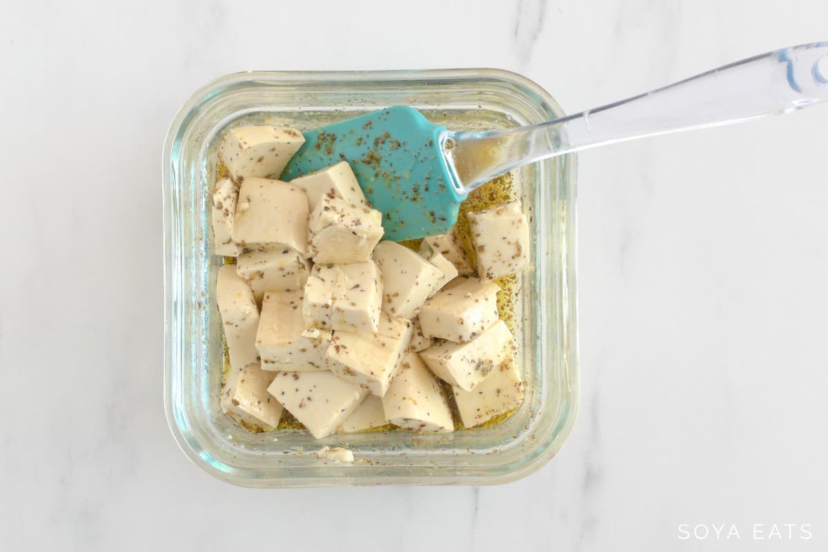 Tofu pieces in a Greek style marinade.